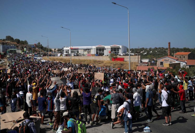 Refugees and migrants from the destroyed Moria camp protest after the news about the creation of a new temporary camp on the island of Lesbos, Greece  September 11, 2020. REUTERS/Alkis Konstantinidis